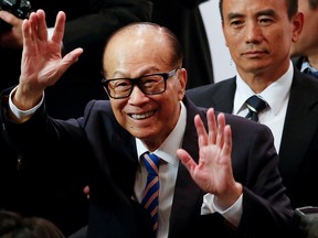 FILE PHOTO: Hong Kong tycoon Li Ka-shing waves goodbye to journalists after announcing his retirement as chairman of CK Hutchison Holdings Ltd at a news conference in Hong Kong, China March 16, 2018.