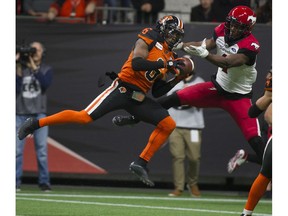BC Lions T.J. Lee intercepts a pass intended for Calgary Stampeders Hergy Mayala at BC Place Nov. 2.