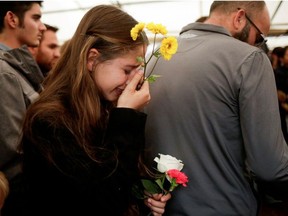 A relative reacts during the burial of Rhonita Miller and her children Howard, Kristal, Titus, and Teana, who were killed by unknown assailants, in LeBaron, Chihuahua, Mexico November 8, 2019.