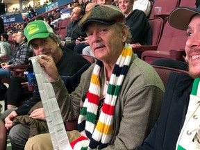 Comedy legend Bill Murray attends Vancouver Canucks game with Oscar winner Peter Farrelly.