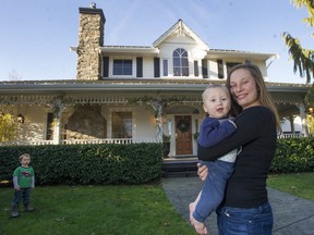 A Christmas home tour is being organized in Abbotsford with the proceeds going toward the charity International Justice Mission, an organization that helps people caught in human trafficking. Pictured is tour organizer Janelle Stauffer, holding son Noah and flanked by other son Silas.