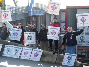 Some of the 3,000 striking Teamsters on a picket line at the CN yard in North Vancouver.