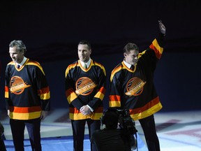 Former Canucks Trevor Linden, Kirk McLean and Pavel Bure wore the Canuck skate sweaters during a special tribute for the late GM and coach Pat Quinn at Rogers Arena on March 17, 2005.