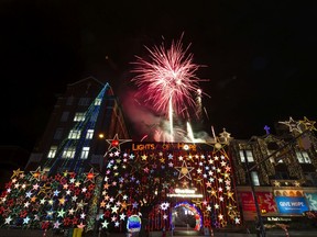 Fireworks burst above the St Paul's Foundation Lights of Hope as the lights were turned on, Vancouver, November 14 2019.