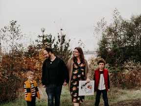 Audrey and Mike Doyle with his two sons Seth and Chase remember their daughter and “littlest big sister.”