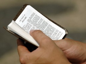 File photo of hands holding a bible.