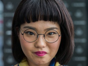 A guest is seen wearing scarf by Hermes, vintage spectacles and thrift-store shirt during the Mercedes Benz Fashion Week TOKYO 2015 A/W at Shibuya Hikarie on March 19, 2015 in Tokyo, Japan.