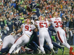 SEATTLE, WA - DECEMBER 29:  Running back Marshawn Lynch #24 of the Seattle Seahawks scores a touchdown against the San Francisco 49ers in the fourth quarter at CenturyLink Field on December 29, 2019 in Seattle, Washington.