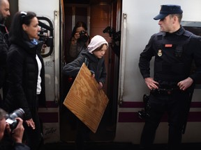 Climate change activist Greta Thunberg arrives at Chamartin train station in Madrid, on December 6, 2019.
