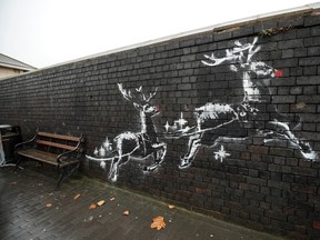Red noses have appeared on Banksy's Birmingham homeless reindeer mural , which has also been fenced off to protect the artwork, on a railway bridge wall in Vyse Street on December 10, 2019 in Birmingham, England.