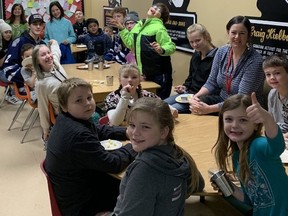 Principal Laury Carriere shares lunch time with students in Creston's Canyon-Lister Elementary.