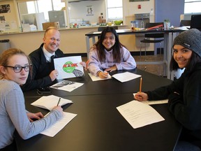 Brett Hancock, principal of the alternative school program in Nanaimo-Ladysmith school district, is shown here with some of his students in the old Woodlands Secondary. The school needs help from Adopt-A-School to buy food and clothes.