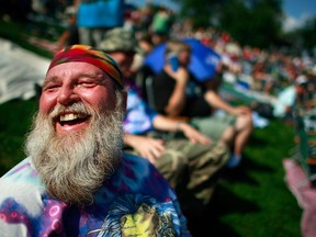 Roger Morris laughs as he waits for the start of the concert marking the 40th anniversary of the Woodstock music festival August 15, 2009 in Bethel, New York.
