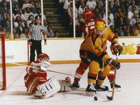 Rich Sutter swoops into score against Mike Vernon in the first round of the 1989 Stanley Cup playoffs.