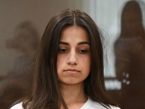 In this file photo taken on June 26, 2019 Angelina Khachaturyan, one of three teenage sisters accused of murdering their father, attends a hearing at a court in Moscow.