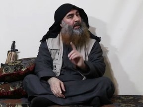 In this undated tv grab taken from a video released by Al-Furqan media, the chief of the Islamic State group Abu Bakr al-Baghdadi appears in a propaganda video from an undisclosed location.