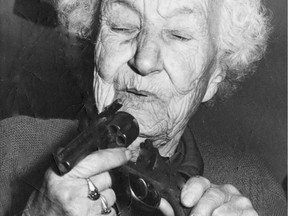 Armed to the teeth and ready for battle robbers she said took almost $15,000 from her week is Mrs. Pansy Mae Stuttard, 84 of White Rock. Grandma Pansy has a loaded a rifle, shotgun and pistol just in case robbers return. She fired two shotgun blasts at robbers Monday, Photo: Ralph Bower