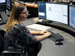 File photo of an E-Comm call taker. E-Comm released its annual Top 10 reasons not to call 911 on Wednesday.