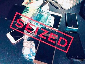 Cash, drugs, a knife and cellphones were seized during a Port Moody traffic stop after an officer spotted what appeared to be a drug deal conducted through a car window.