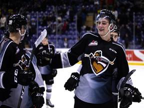 Evan Patrician celebrates with other Vancouver Giants in Vancouver's 2-1 win over the Victoria Royals Friday in Victoria.