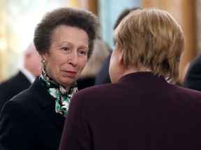 Britain's Princess Anne (L) speaks with German Chancellor Angela Merkel (R) at Buckingham Palace in central London on December 3, 2019, during a reception hosted by Britain's Queen Elizabeth II ahead of the NATO alliance summit.