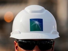 An employee in a branded helmet is pictured at Saudi Aramco oil facility in Abqaiq, Saudi Arabia, October 12, 2019.