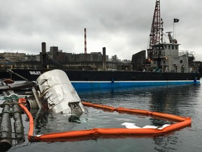 An ocean transportation company says it has retrieved a tank trailer filled with liquefied dead fish, shown in this handout image, after it was knocked into the waters off Vancouver Island. Billy Vaughn of Coastal Seatrucking says the silage was pumped into another tanker Tuesday morning and the trailer was removed from the ocean.