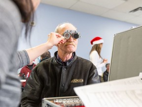 Clients of The Salvation Army in Vancouver's Downtown Eastside receive eye exams at a clinic hosted by The Eyeglasses Project on Sunday, Dec. 15, 2019.