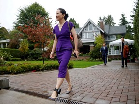 Huawei Technologies Chief Financial Officer Meng Wanzhou leaves her home in Vancouver wearing an electronic monitoring device.