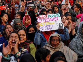 Demonstrators attend a protest against a new citizenship law, outside the Jamia Millia Islamia university in New Delhi, India, December 22.