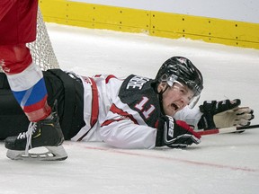 Canada's Alexis Lafreniere reacts after being upended by Russia's Yegor Zamula(4) during action at the World Junior Championship, Saturday, December 28, 2019 in Ostrava, Czech Republic. (THE CANADIAN PRESS/Ryan Remiorz)