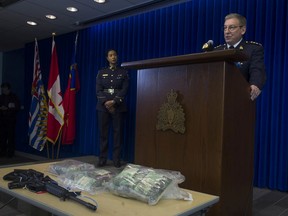 Yvette-Monique Gray of the Canada Border Services Agency (left) and Chief Supt. Keith Finn of the RCMP (at podium) at the Thursday, Dec. 19, 2019 news conference on the large seizure of fentanyl.