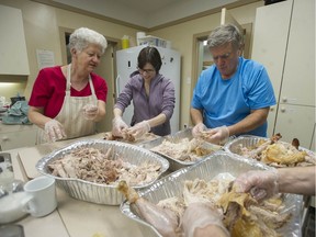 Volunteers prepare food for a dinner for former prison inmates and their families and friends at the All Saints Anglican church in Mission, B.C. on December 19, 2019.
