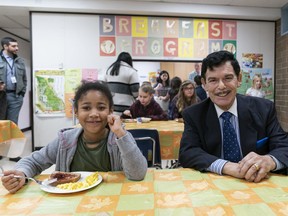 Hazel-b Bruce enjoys her breakfast with donor Jack Kowarsky at her side during the latter’s visit to the breakfast program at Prince Charles elementary in Surrey recently. Kowarsky is the single largest contributor to the Attendance Matters program through Adopt-A-School.