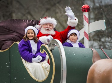 Santa waves to onlookers during the Santa Claus Parade