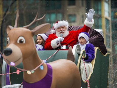 Santa waves to onlookers during the Santa Claus Parade.