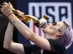 Megan Rapinoe kisses the trophy in front of City Hall after the ticker tape parade for the women's World Cup champions on July 10, 2019 in New York. (JOHANNES EISELE/AFP/Getty Images)