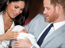 Prince Harry and Meghan, Duchess of Sussex hold their newborn son, Archie, at Windsor Castle, May 8, 2019.
