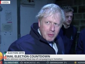 British PM Boris Johnson was recorded hiding in a fridge in an attempt to avoid questions from a reporter early Wednesday morning.