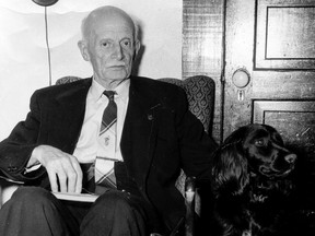 Former federal and provincial politician Alan Webster Neill sits with his dog in a photo from 1955 at the age of 87. The Alberni School District in B.C. is preparing a public consultation for the renaming of A.W. Neill Elementary School, over Neill's support of anti-Chinese laws in the legislature and his approval of Indigenous residential schools.