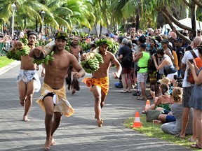 Competitors from five Polynesian nation race in fruit and vegetable-carrying races in Pape’ete.