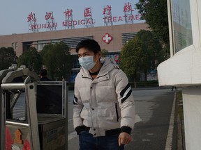 A man leaves the Wuhan Medical Treatment Centre.