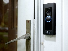 A doorbell device with a built-in camera made by home security company Ring.