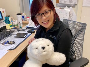 Nurse and clinical researcher Lillian Hung with Caspar, the "PARO", or artificial intelligence seal being used with dementia patients at VGH.