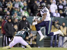 David Moore #83 of the Seattle Seahawks carries the ball against Cre'von LeBlanc #34 of the Philadelphia Eagles during the NFC Wild Card Playoff game at Lincoln Financial Field on January 05, 2020 in Philadelphia, Pennsylvania.