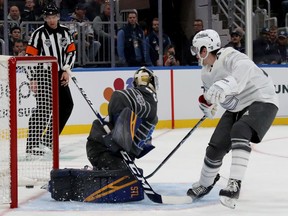 Quinn Hughes of the Vancouver Canucks scores over goaltender Jordan Binnington of the St. Louis Blues in the game between Pacific Division and Central Division during the 2020 Honda NHL All-Star Game at Enterprise Center on January 25, 2020 in St Louis, Missouri.