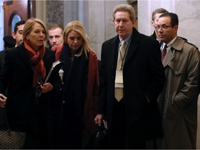 WASHINGTON, DC - JANUARY 28:  Attorneys for President Donald Trump, Jane Raskin (L), Pam Bondi (2nd L) and Michael Purpura (R) arrive at the U.S. Capitol for the Senate impeachment trial at the U.S. Capitol on January 28, 2020 in Washington, DC. President Donald Trump's legal defense team is expected to conclude their arguments today and begin answering written questions from Senators on Wednesday.