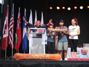 From left, Team B.C. elder Alex Nelson, with flag-bearers Camryn Scully (Métis Nation) and Keegan Charlie (Sts'ailes First Nation) and Team B.C. chef de mission Lara Mussell Savage, at the Toronto 2017 North American Indigenous Games closing (NAIG) ceremony where they accepted the Overall Team Award. Team B.C. will send 520 athletes, coaches and staff to the Halifax 2020 NAIG in July.