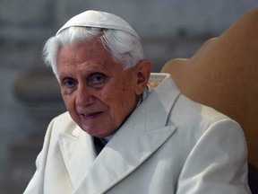 This file photo taken on December 8, 2015 shows Pope Emeritus Benedict XVI at St Peter's basilica before the opening of the "Holy Door" by Pope Francis to mark the start of the Jubilee Year of Mercy.