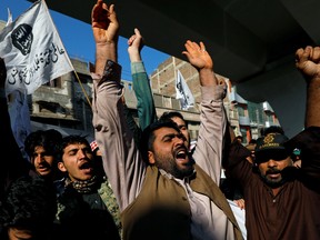 People chant slogans during a protest over the death of Iranian Major-General Qassem Soleimani, who was killed in an air strike near Baghdad, in Peshawar, Pakistan January 10, 2020.